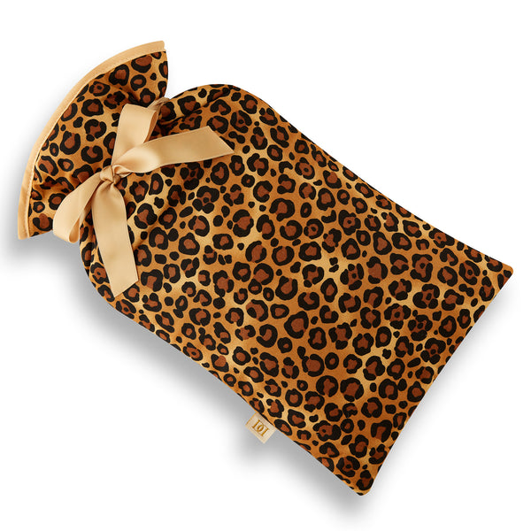 Beige, brown and black leopard print cotton hot water bottle cover.  Beige trim and ribbon bow.  2 litre cream hot water bottle included.